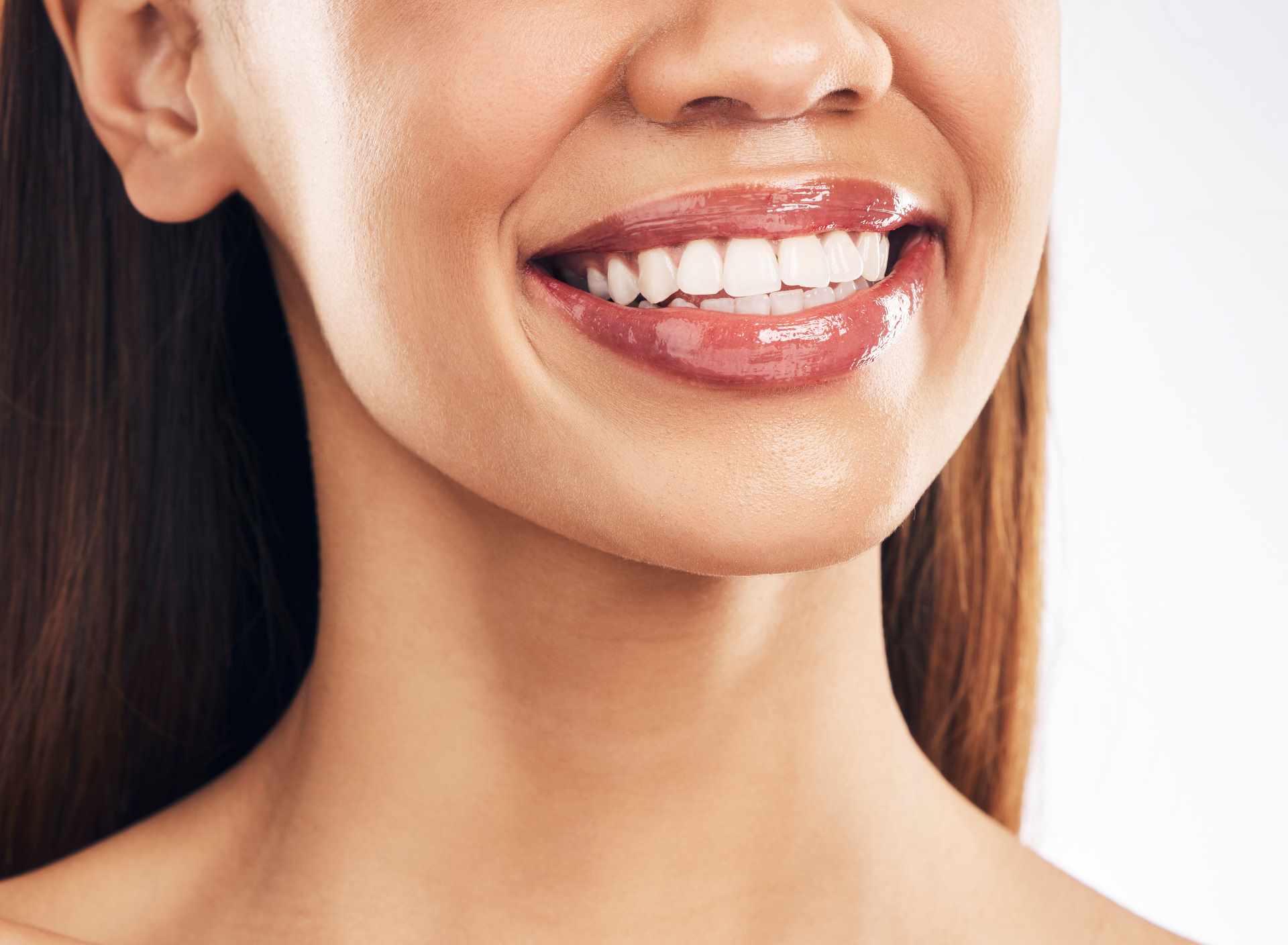 Woman smiling | Featured image for the Oral Microbiome: What is It & Why is It Important? blog by Pearl Denture Studio.